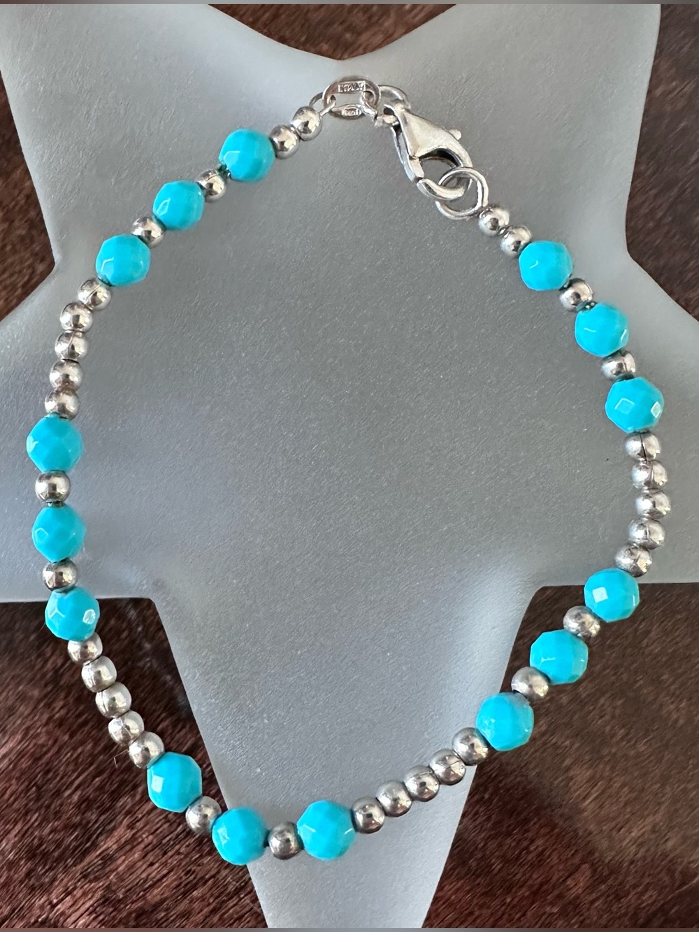 Sterling silver beaded bracelet with turquoise colored accent beads, 7.25in